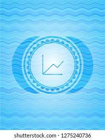 chart icon inside water wave concept badge.