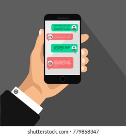 Chat concept. Hand holds smartphone with dialog boxes. Flat design of messaging bubbles. Chatting witn robot and human. Vector illustration. Isolated.