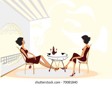 Chatting girls drinking coffee