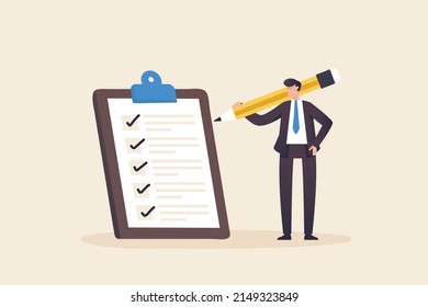 Check documents, check list Sign documents or business certificates, contracts.
Businessman holding pencil at big complete checklist with tick marks.