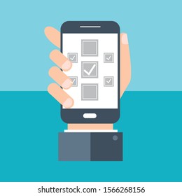 Check mark on smartphone screen. Hand holds the smartphone and finger touches screen