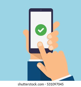 Check Mark On Smartphone Screen. Hand Holds The Smartphone And Finger Touches Screen. Modern Flat Design Illustration.