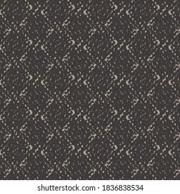 Checkered cotton sweater with black and gray thread in the mix. Rug texture.