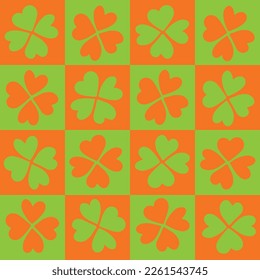 Checkered green and orange Clovers seamless pattern for Saint Patrick's Day.  For textile, wrapping paper, packaging, decor, DIY projects.