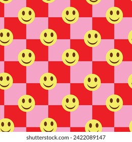 Checkered yellow happy faces on red and pink checkerboards seamless pattern. For stationary, wrapping paper and kids fabric 