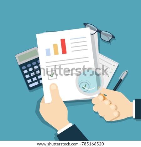 Checking the documents with magnifying glass on table.
