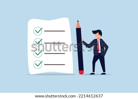 Checklist for work. confident businessman standing with pencil after completed all tasks checklist