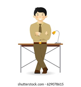Cheeky asian man in shirt and trousers posing. Leaned on the table.