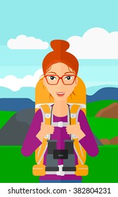 Cheerful backpacker with binoculars.