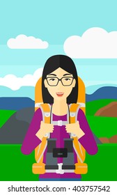 Cheerful backpacker with binoculars.
