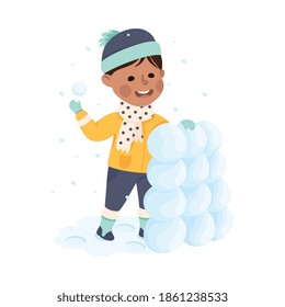 Cheerful Boy Building Snow Tower from Snowballs Vector Illustration