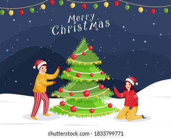 Cheerful Boy and Girl Wearing Woolen Clothes with Decorative Xmas Tree on Snowfall Background for Merry Christmas Celebration.