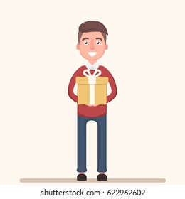 Cheerful boy holds a big gift in his hands. Vector illustration in a flat style.