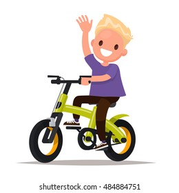 Cheerful boy rides a bicycle. Vector illustration of a flat design