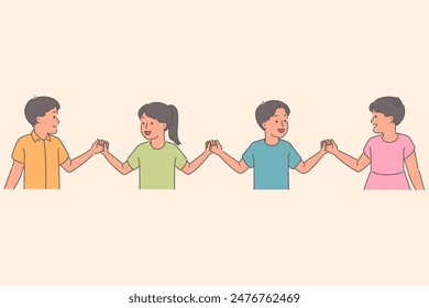 Cheerful children hold hands standing in row and laugh while participating in school games for socialization of primary students. Group of happy school children demonstrating cohesion and unity