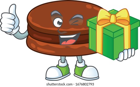 Cheerful chocolate alfajor cartoon character holding a gift box