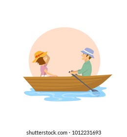 cheerful cute couple having a romantic trip on a rowing boat