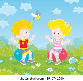 Cheerful cute little kids in colorful sport clothes doing exercises on big fitness balls in a gymnastic lesson on a green playground in a summer park, vector cartoon illustration