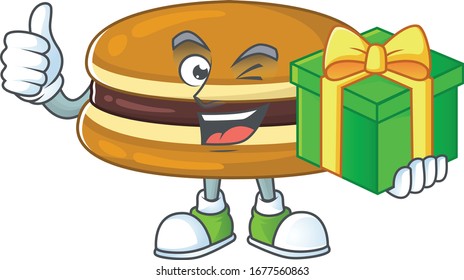 Cheerful dorayaki cartoon character holding a gift box