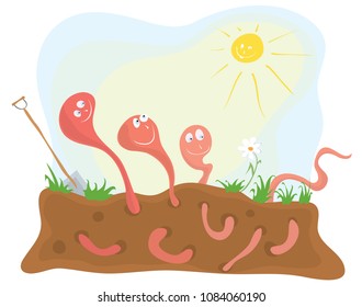 Cheerful earthworms under  warming  sun on the flower bed / break during work day
