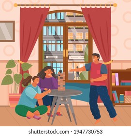 La familia alegre juega en la torre. Las personas con juegos de mesa pasan tiempo y se comunican en la sala de estar