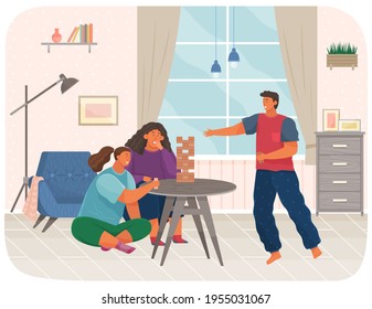 Cheerful family plays tower game. People with board games spend time and communicate in living room