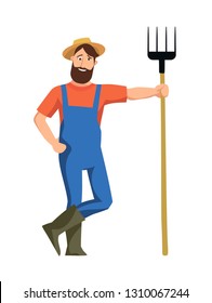 Cheerful farmer stands and leans on the pitchfork