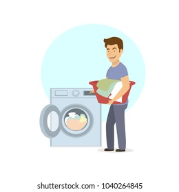 cheerful funny man washing clothes laundry in washing machine