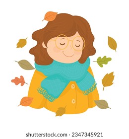 cheerful girl throws leaves in autumn in a yellow raincoat and scarf