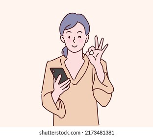 Cheerful girl using the smartphone and show the symbolic finger indicating OK. Hand drawn in thin line style, vector illustrations.