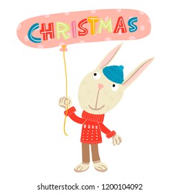 cheerful hare in a blue hat and a red sweater with a white pattern, standing with a ball of pink polka dots in his hands with the inscription-Christmas