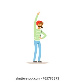 Cheerful hipster holding funny mustache on stick. Masquerade, birthday or bachelor party. Cartoon young man character having fun. Isolated flat vector
