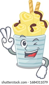 Cheerful ice cream banana rolls mascot design with two fingers