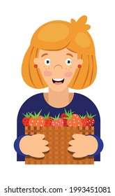 Cheerful joyful girl with a smile on her face and a basket of strawberries in her hands