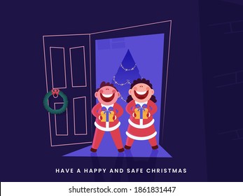 Cheerful Kids Holding Gift Box At Door With Decorative Xmas Tree For Happy and Safe Christmas Celebrate.