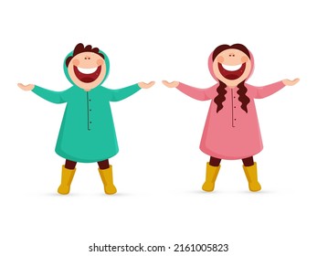 Cheerful Little Boy And Girl Wearing Raincoat In Standing Pose Against White Background.