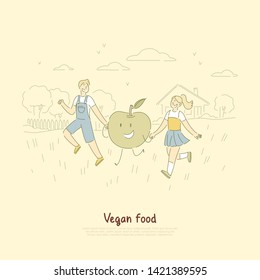 Cheerful little children on stroll, boy and girl holding hands with delicious friendly apple, vegan food banner