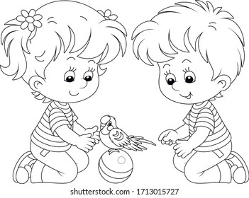 Cheerful little children playing with a funny small parrot with a long tail, black and white outline vector cartoon illustration for a coloring book page