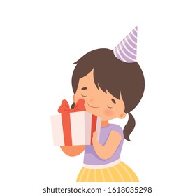 Cheerful Little Girl Wearing Birthday Hat Holding Gift Box Tied with Red Ribbon Vector Illustration