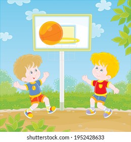 Cheerful little kids playing basketball with a big orange ball on a sports ground in a green park on summer vacations, vector cartoon illustration