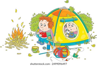 Cheerful little kids tourists with a merry pup resting in their camp tent by a campfire, vector cartoon illustration