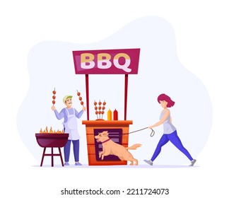 Cheerful man cooking grilled meat and selling tasty fried meat at outdoor summer booth. Young woman walking with dog passing by BBQ kiosk. Street food seller grilling and selling barbecue from stall