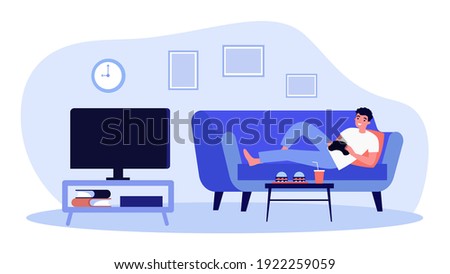 Cheerful man lying on sofa and playing video game. Fun, home, console flat vector illustration. Entertainment and weekend concept for banner, website design or landing web page