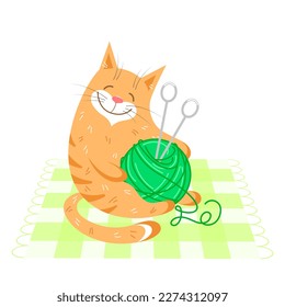 Cheerful red cat with a ball of green yarn and knitting needles on a checkered rug on a white background