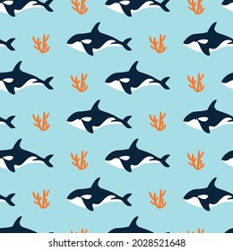 Alegre patrón sin fisuras con ballena asesina y coral en un fondo azul. Textil, impreso en ropa. Ilustración vectorial en estilo plano