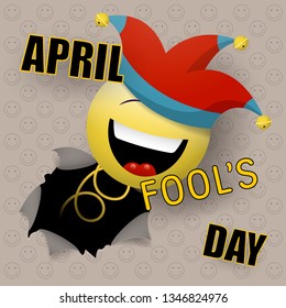 A cheerful smiling face, in a jester's cap, suddenly breaks through the wall. Happy fools day. Vector illustration.