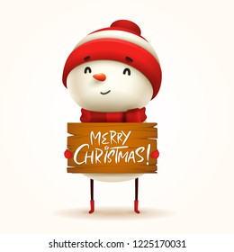 Cheerful snowman holds a wooden board with Christmas greetings. Isolated. 