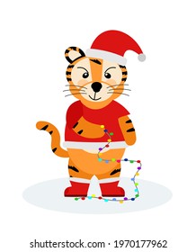 A cheerful striped tiger in a Christmas Santa costume with a garland, the symbol of 2022. Vector illustration isolated on a white background drawn by hand. For printing children's T-shirts, postcards,