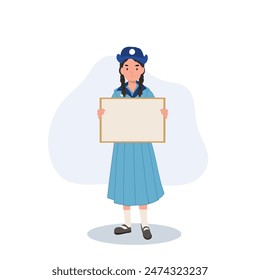 Cheerful Thai Girl Scout Holding Blank Board. Space for Text