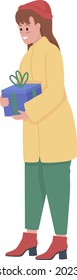 Cheerful woman holding gift box semi flat color vector character. Full body person on white. Girl wearing winter outfit isolated modern cartoon style illustration for graphic design and animation